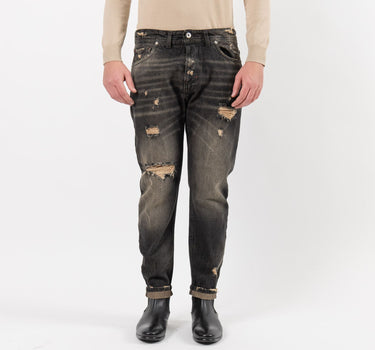 Jeans with shaded effect tears